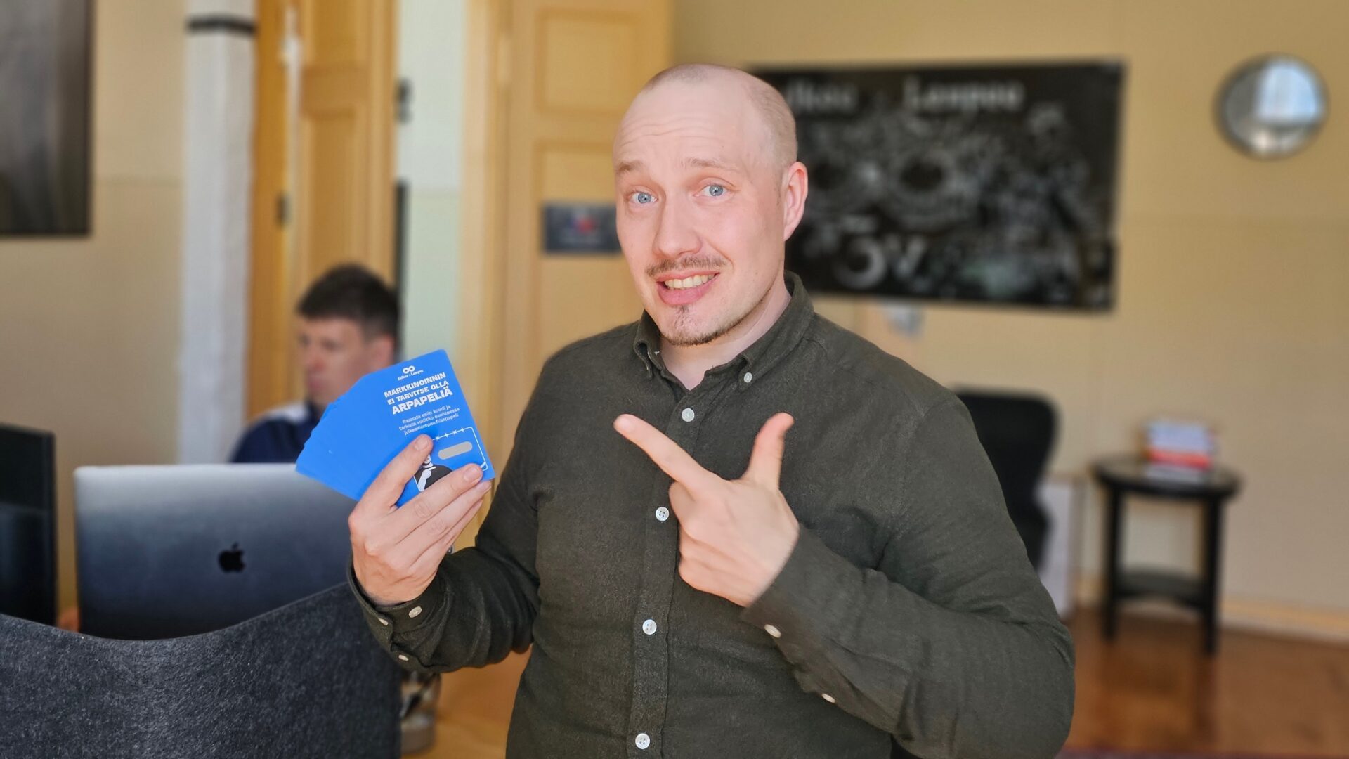 a man pointing at a blue passport